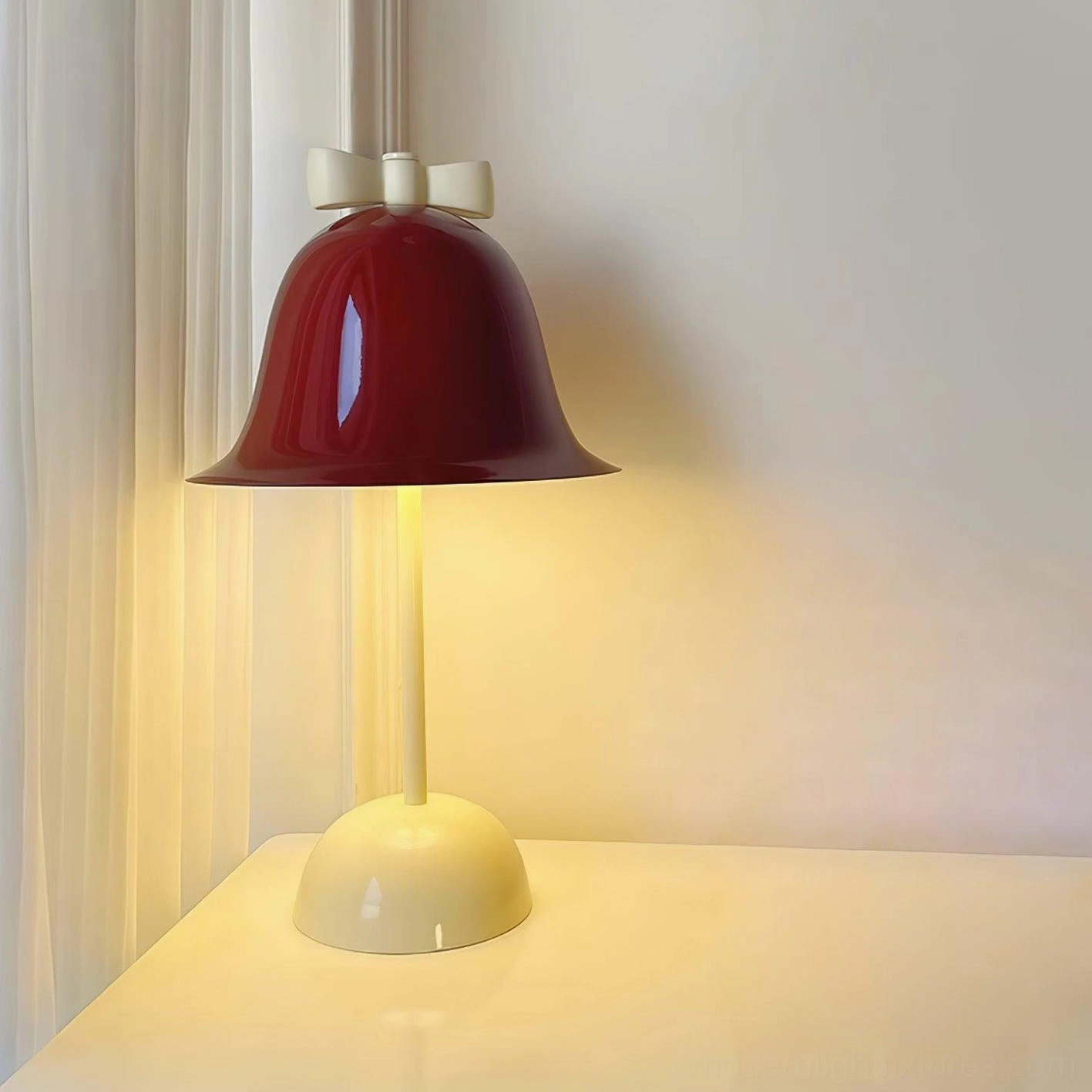 Illuminated table lamp on windowsill with warm white LED glow and sheer curtains at dusk