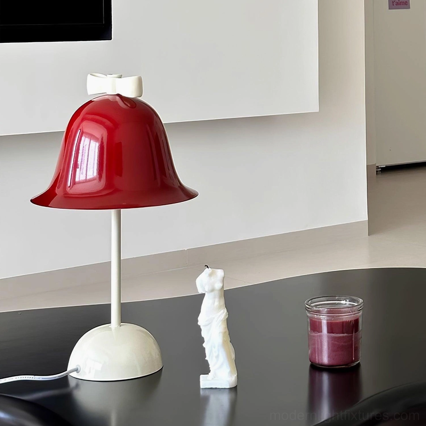 Modern minimalist table lamp showing integrated LED technology and push-button control mechanism