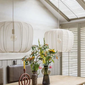 White Nevola fabric pendant lamp hanging in modern dining room, contemporary home interior lighting