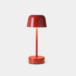 Nico cordless LED table lamp with glossy red metal finish, minimalist mushroom design on white background