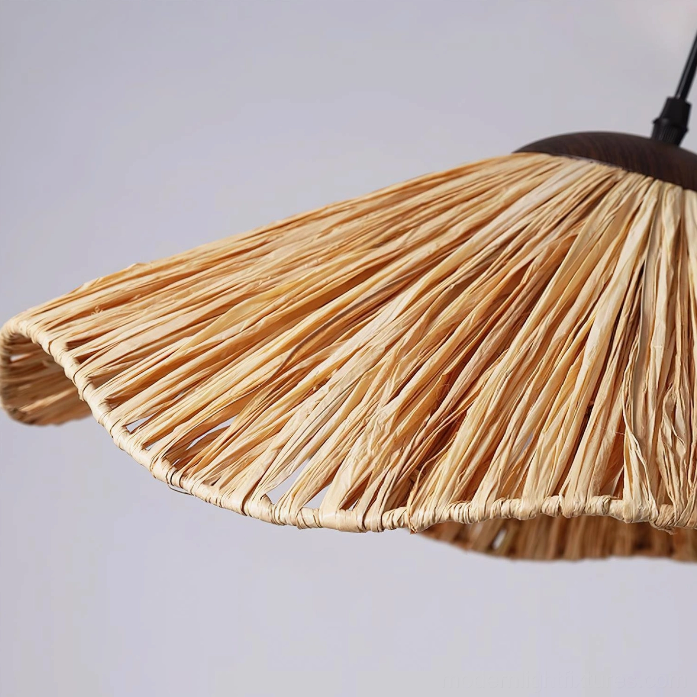 Wavy rattan pendant light creating soft diffused ambient lighting through natural woven material