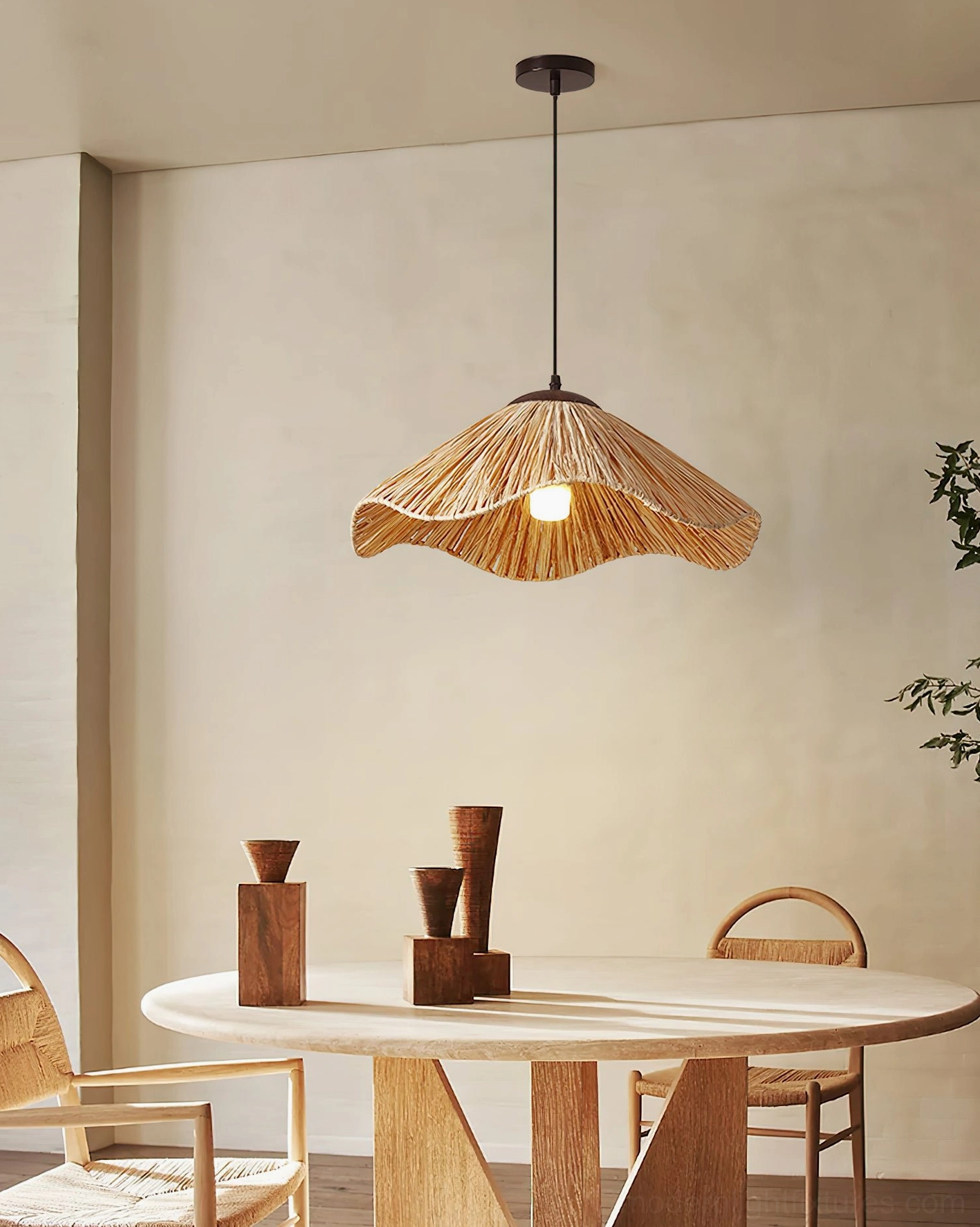 Nikita bohemian rattan pendant light in rustic dining room setting above wooden furniture