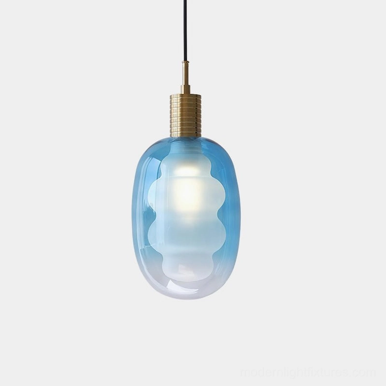 Nimbus handblown glass pendant light with blue gradient shade and brass metal fitting, overhead studio view, modern minimalist design