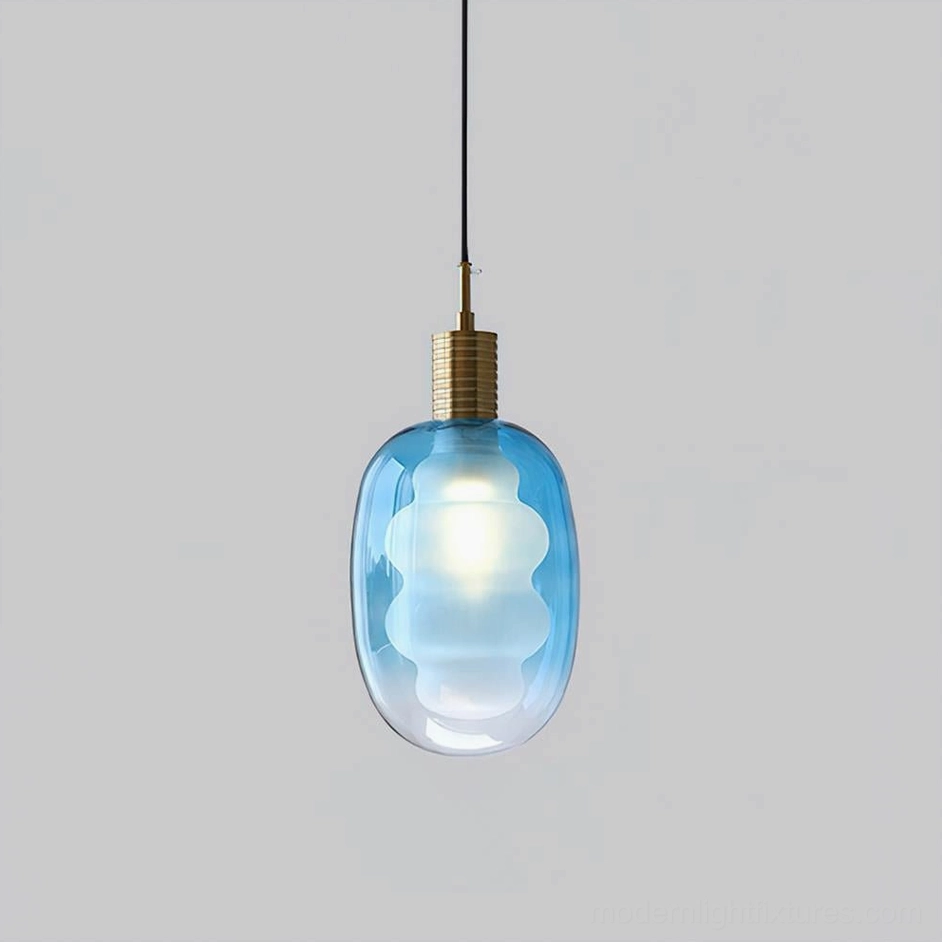 Nimbus Gold and Blue pendant light, jewel-toned elegant color combination, handblown glass with brushed brass metal fitting