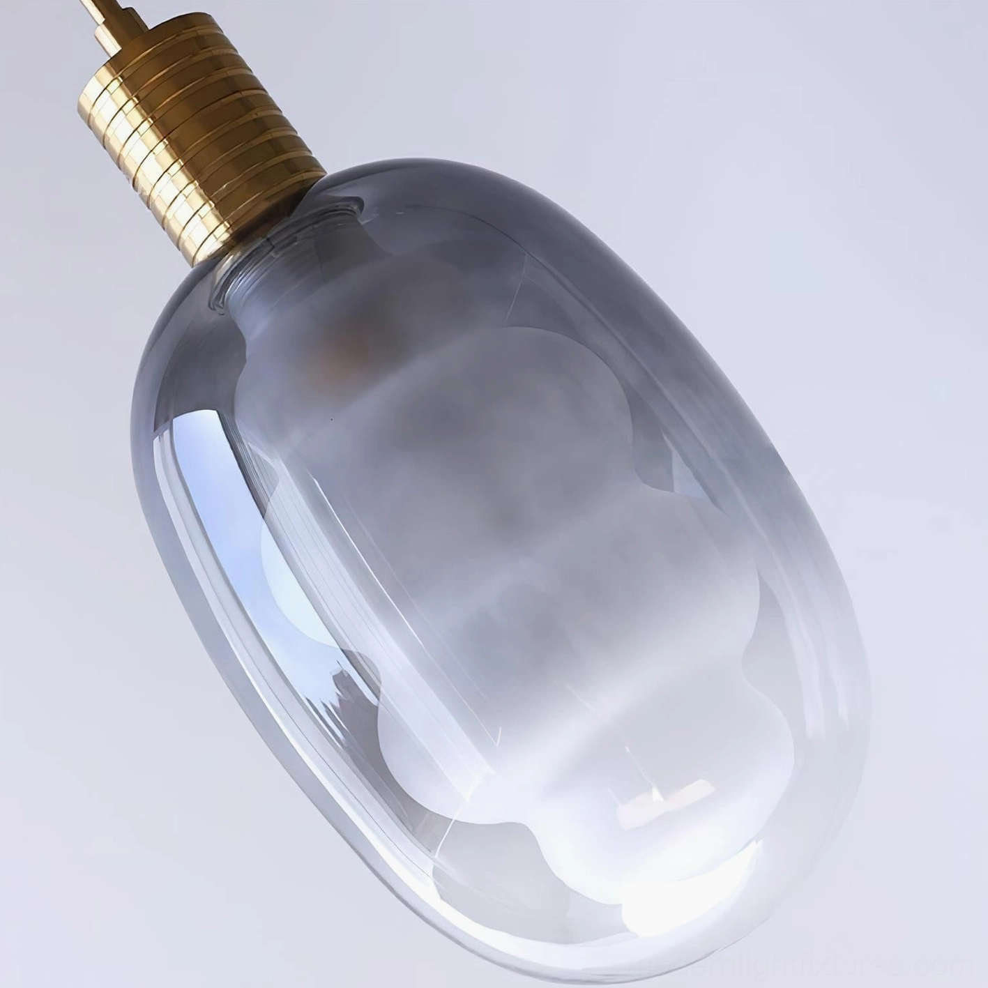 Handcrafted Nimbus glass pendant light with smoke gray shade and brass fitting mounted over wooden shelf in Nordic interior