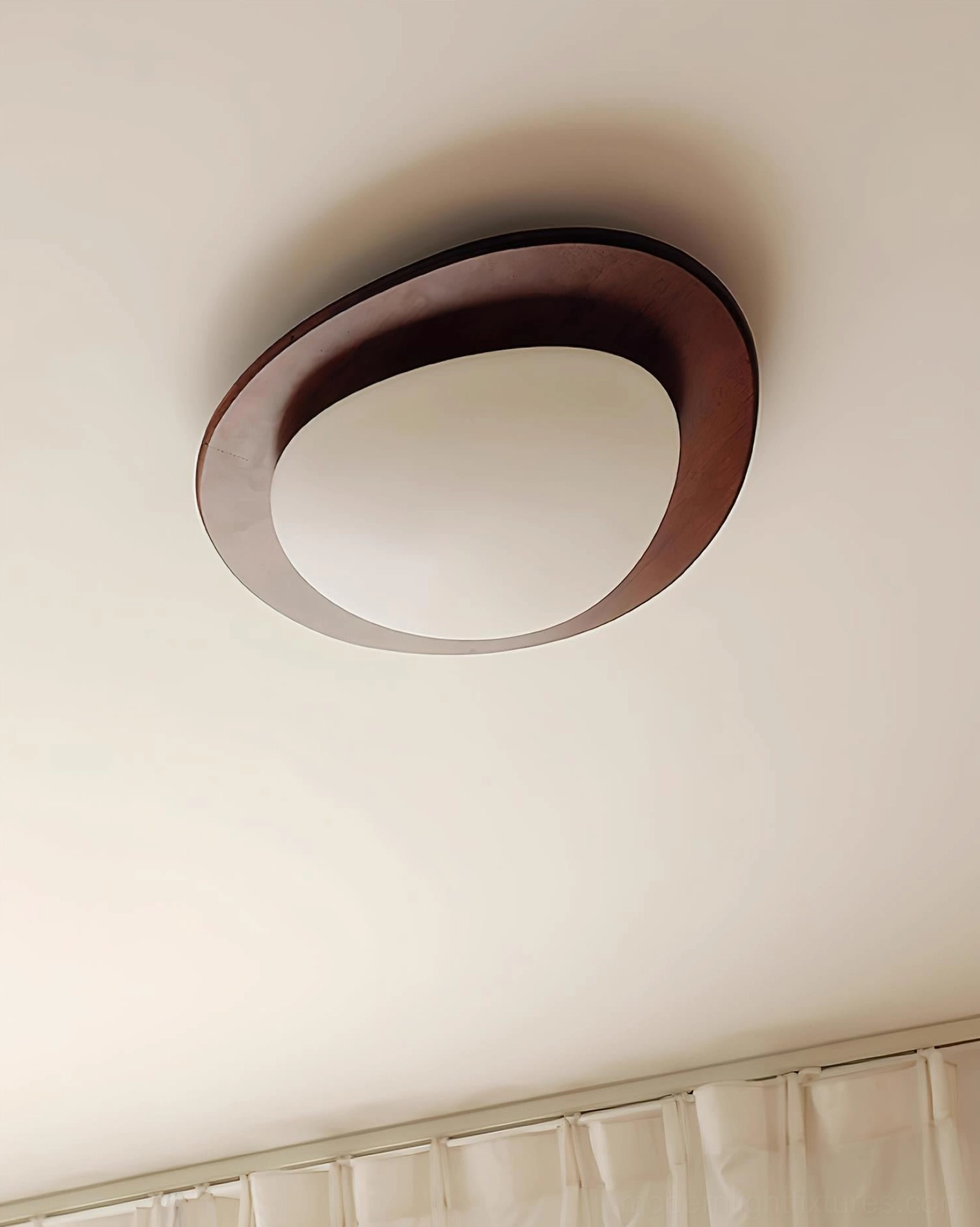 Niseko ceiling light fixture lifestyle image in contemporary interior setting with warm ambient glow effect