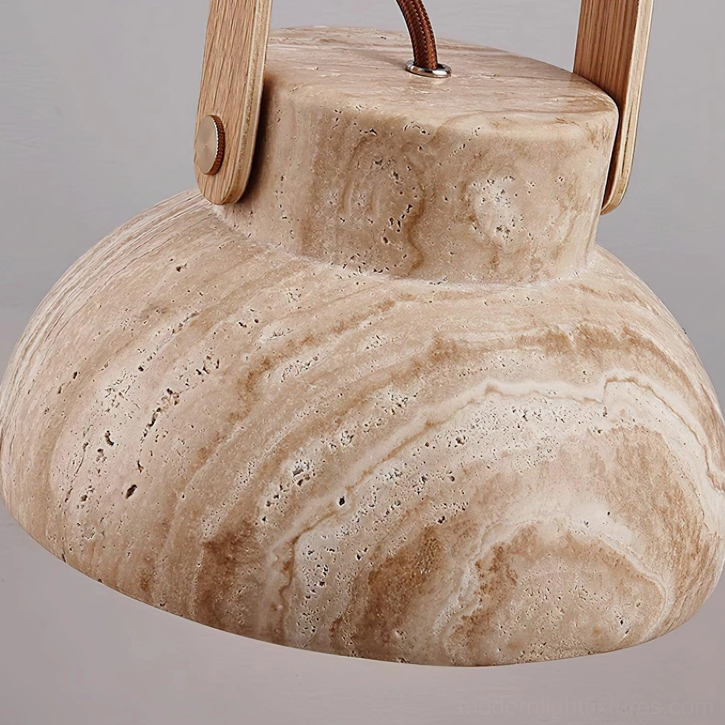 Multiple Nissa travertine pendant lights in coordinated multi-pendant design configuration