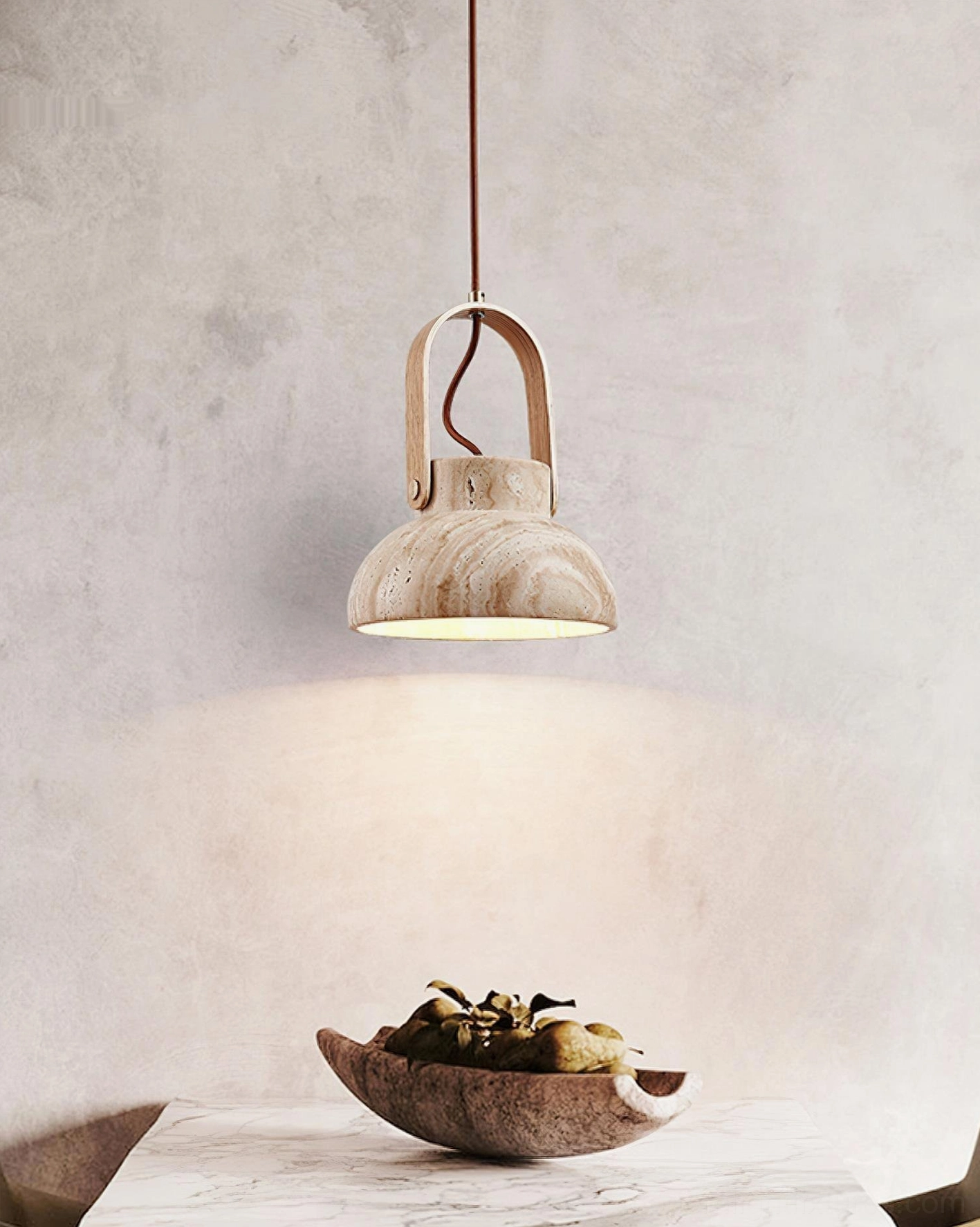 Travertine stone pendant lamp over minimalist dining table, concrete wall and marble top background