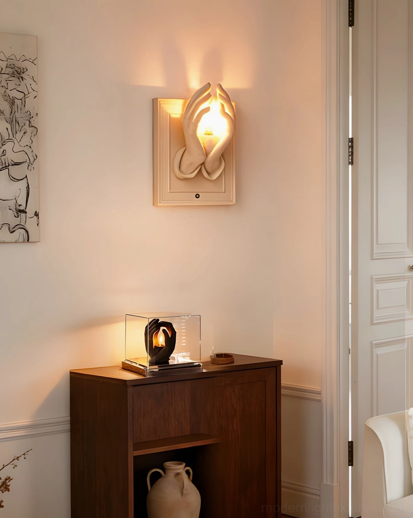 Beige artistic wall sconce with curved flame-style sculptural form in minimalist entryway lounge