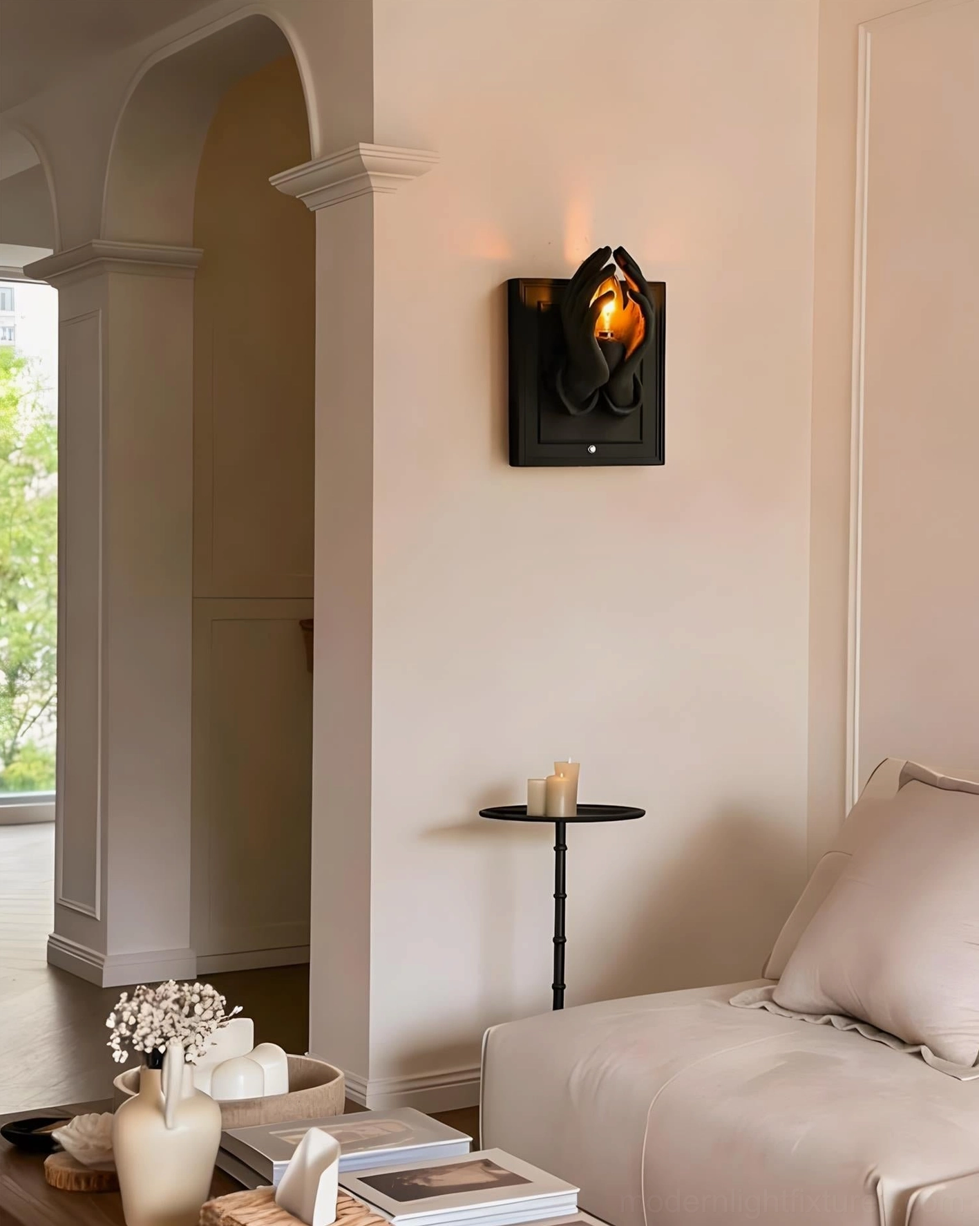 Noctara wall sconce showcasing minimalist backplate and sculptural hands in modern home setting