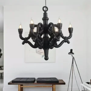 Black knotted pendant chandelier illuminated in minimalist residential lounge setting contemporary lighting