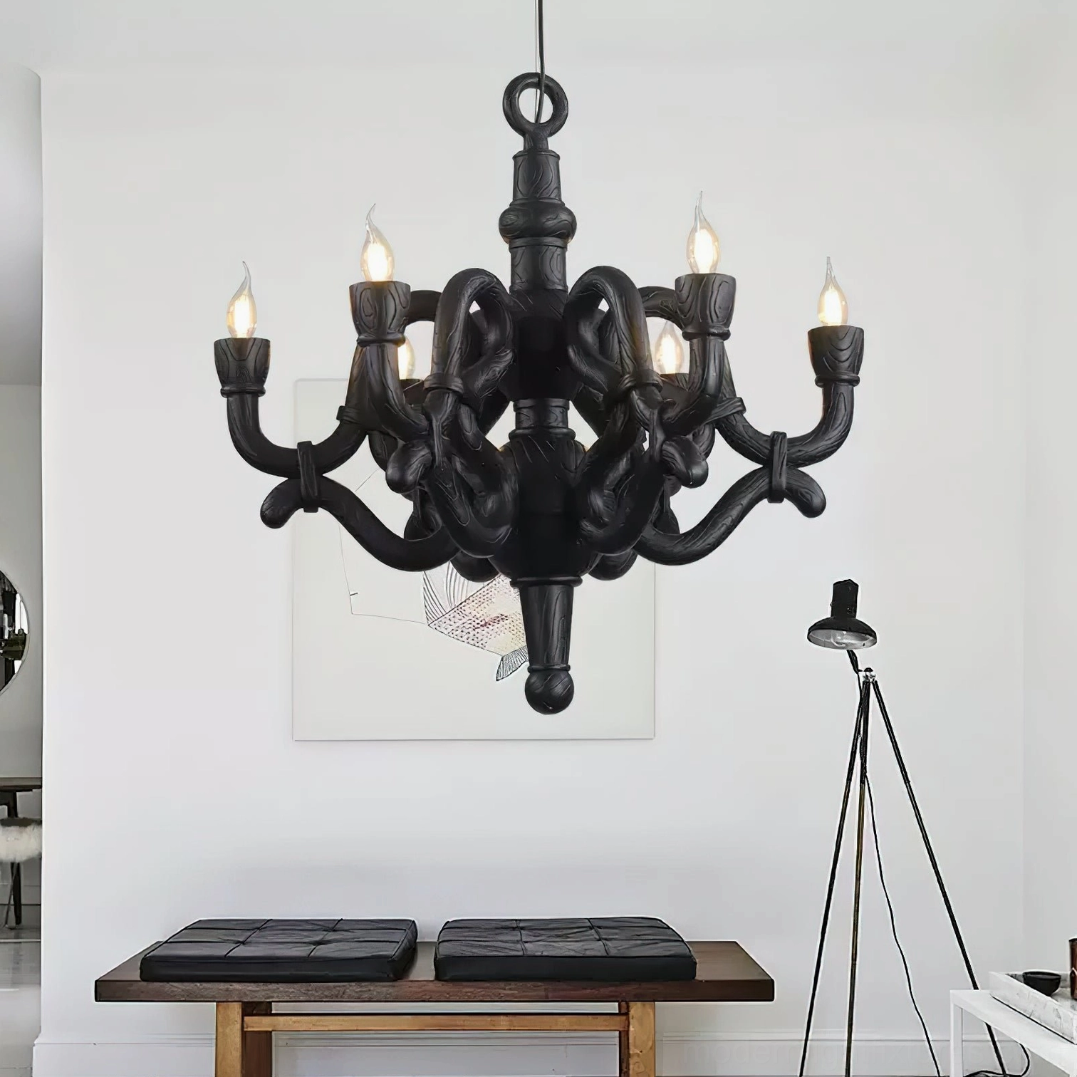 Black knotted pendant chandelier illuminated in minimalist residential lounge setting contemporary lighting