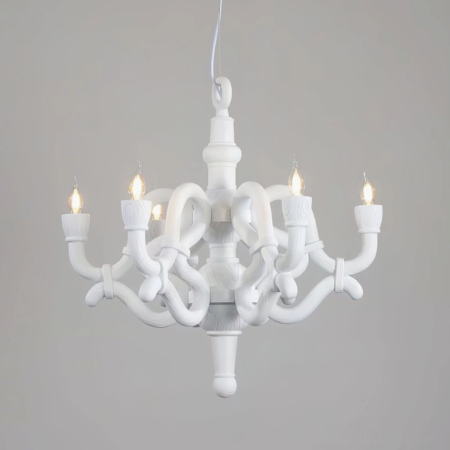 White knotted candle-style chandelier matte finish warm lighting studio backdrop modern baroque