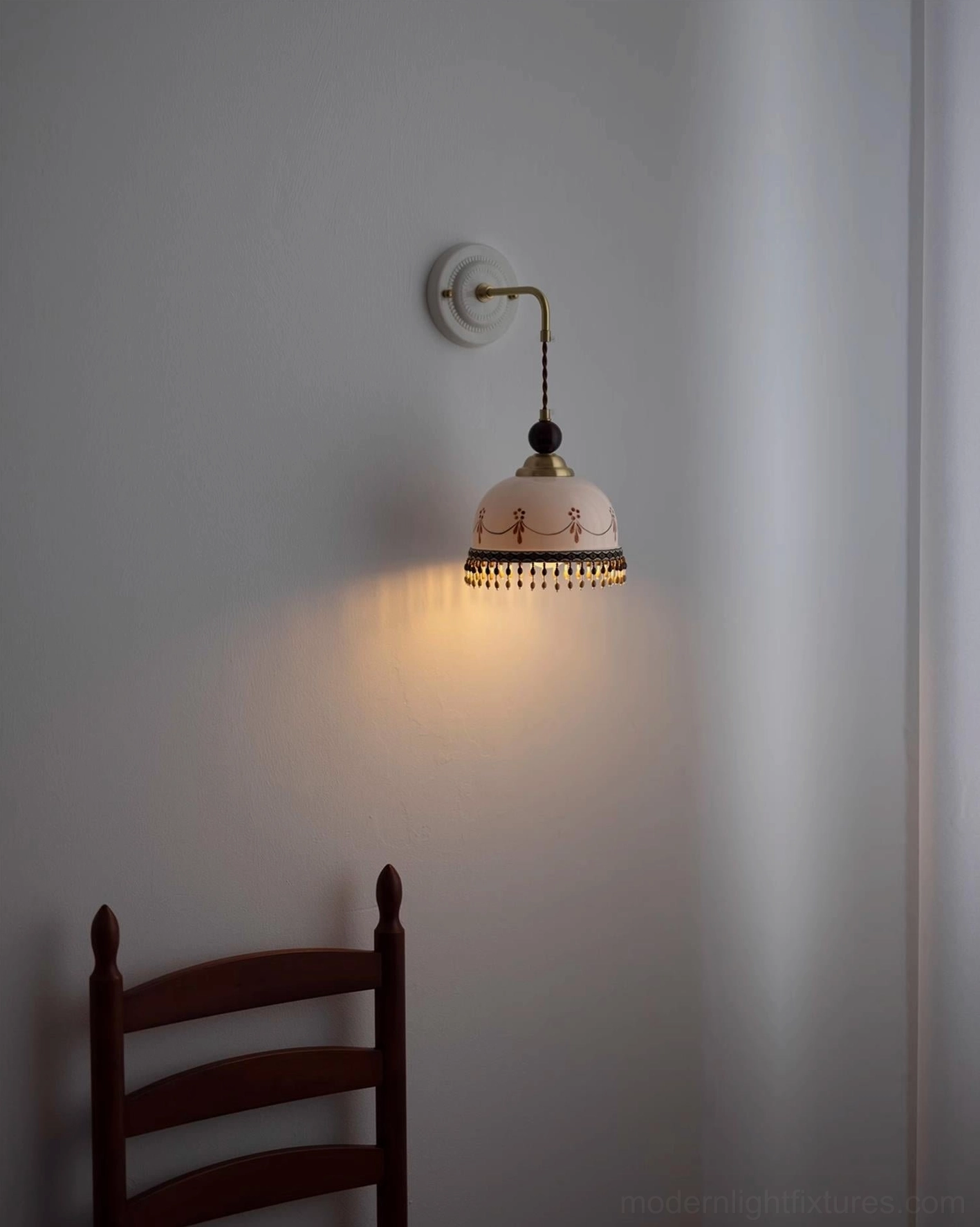 Noemi ceramic wall lamp gallery wall display, hand-painted garland motif, beaded fringe accent, multiple fixture arrangement
