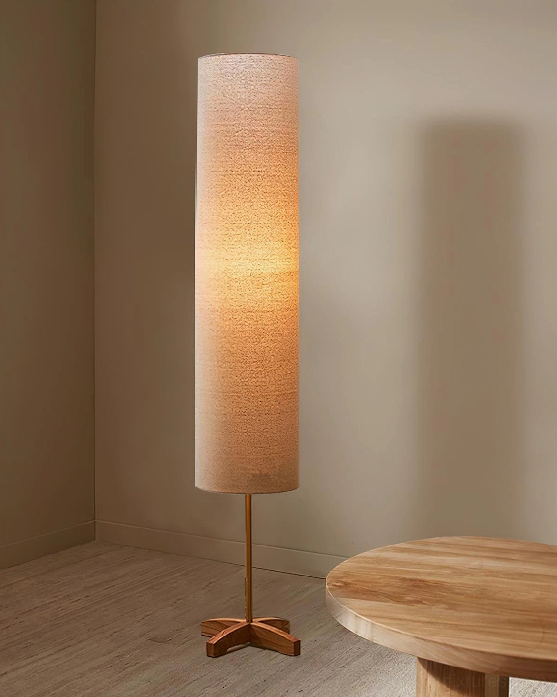 Nomi floor lamp illuminated in cozy tea corner with warm ambient light and wooden side table