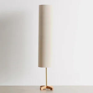 Nomi tall scandinavian floor lamp with fabric shade in minimalist interior studio setting
