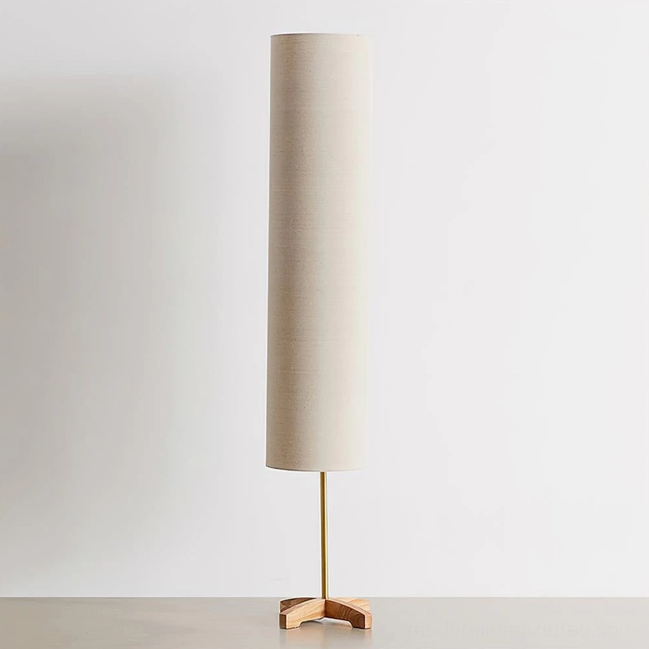 Nomi tall scandinavian floor lamp with fabric shade in minimalist interior studio setting