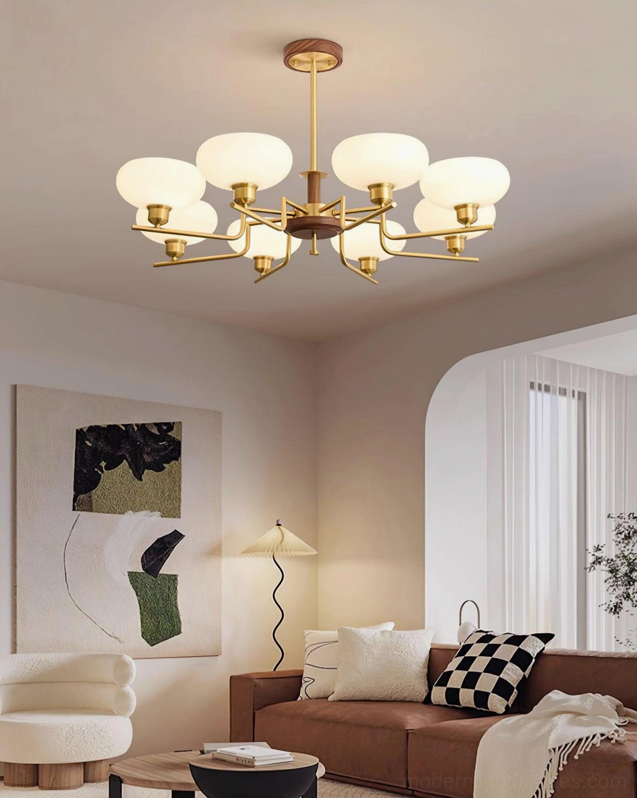 Nordic style 8-head glass pendant chandelier in warm minimalist living space with brown sofa and neutral decor