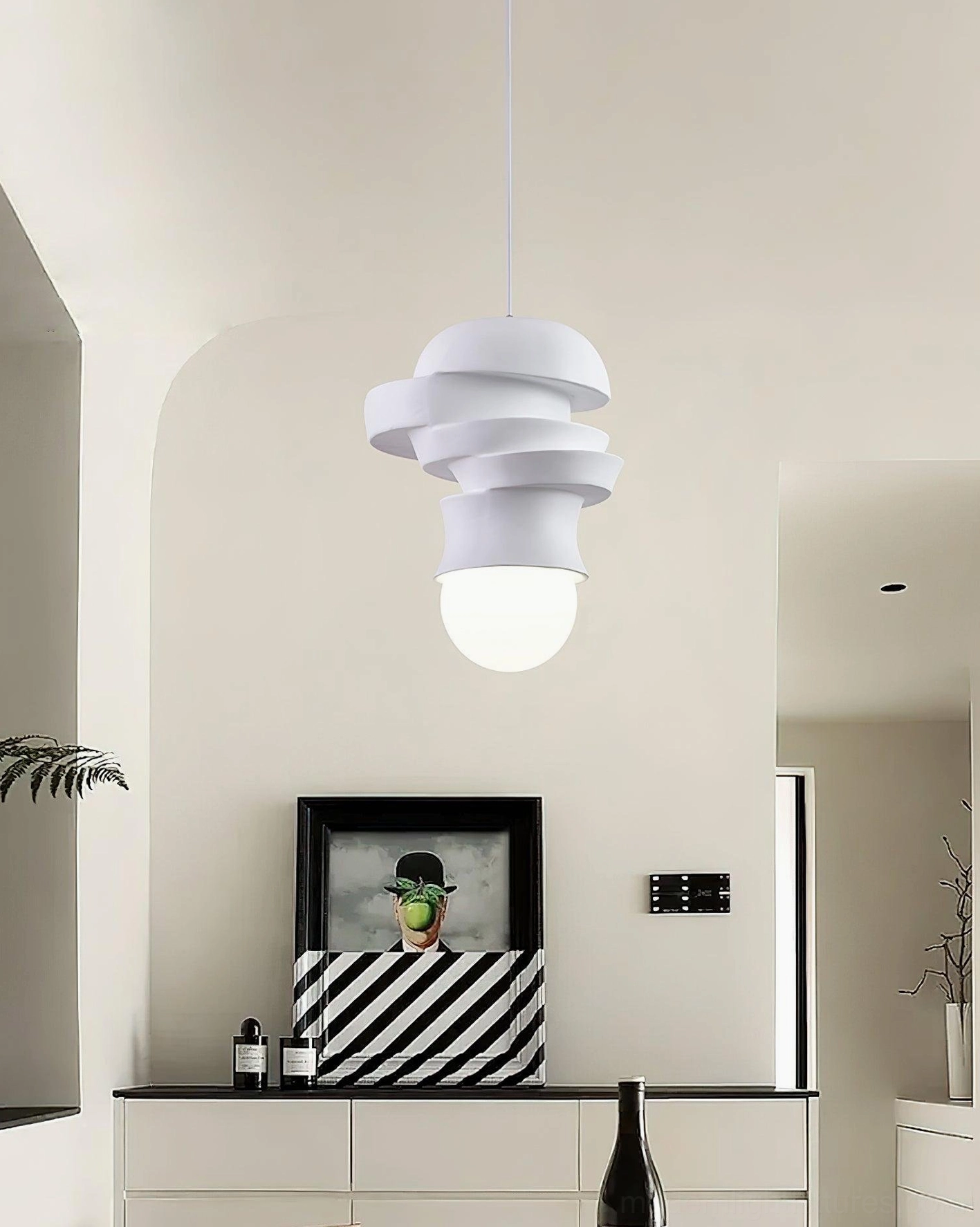 Single modern pendant light with stacked white discs installed in minimalist Nordic interior, side view of console area