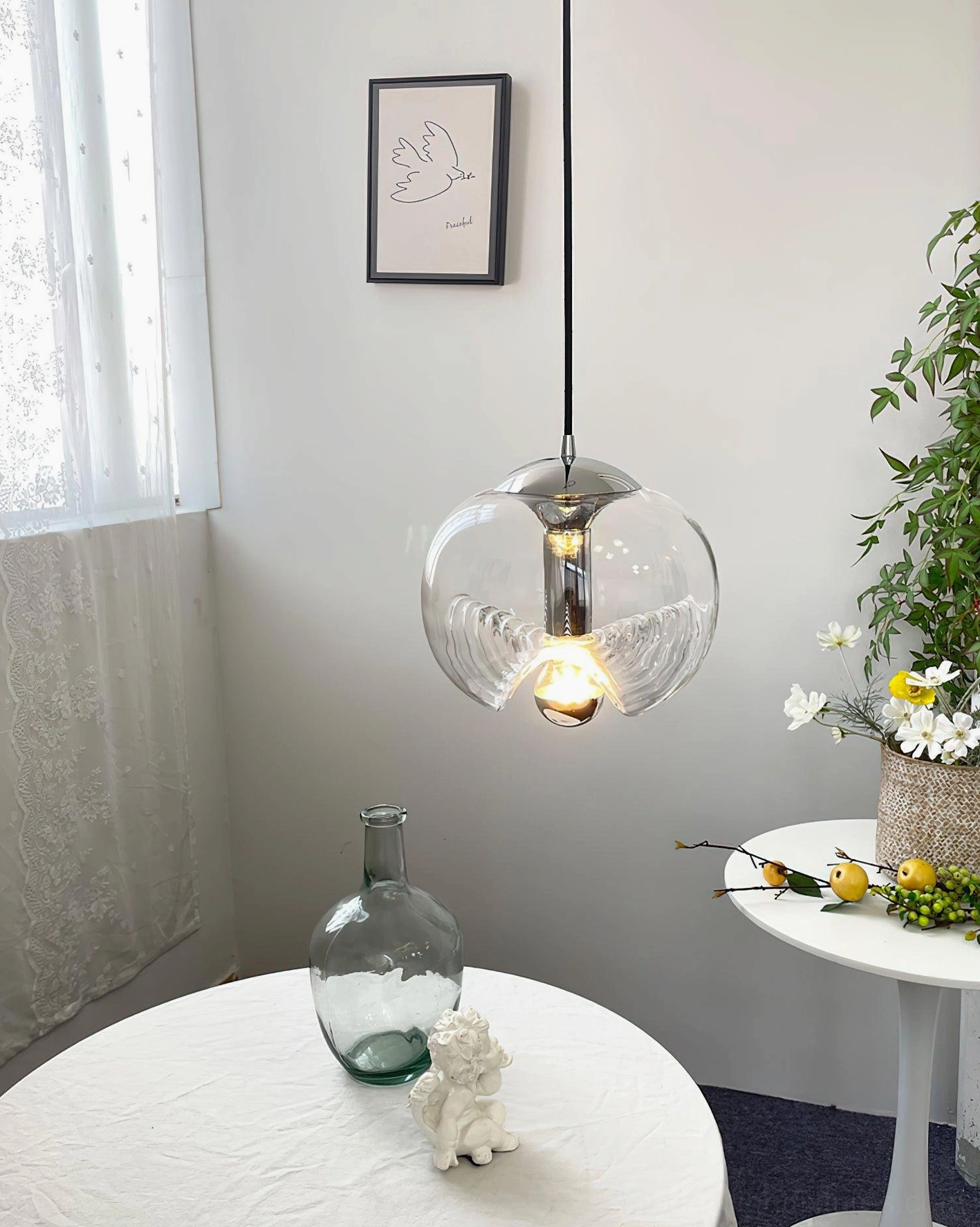 Nordic minimalist pendant light in residential lounge area, eye-level view with home plants and contemporary interior decor styling