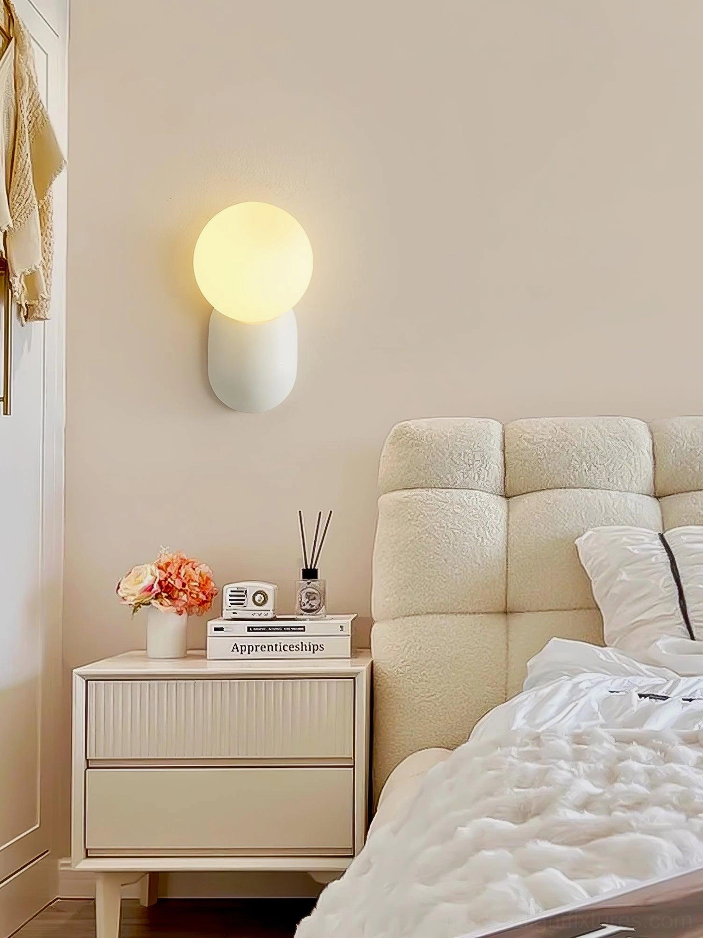 Nordic design wall sconce paired with contemporary bedroom furniture and neutral wall decor scheme