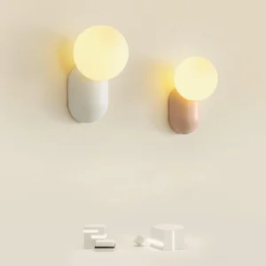 Dual pack of Nordic minimalist wall sconces in complementary colors - off-white and terracotta variants displayed flat lay