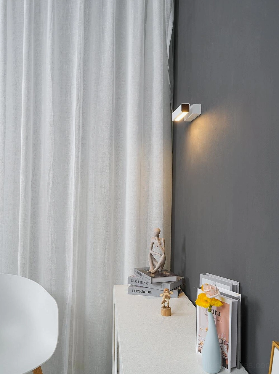 Rotatable Nordic wall lamp showing warm LED lighting and adjustable positioning in living space
