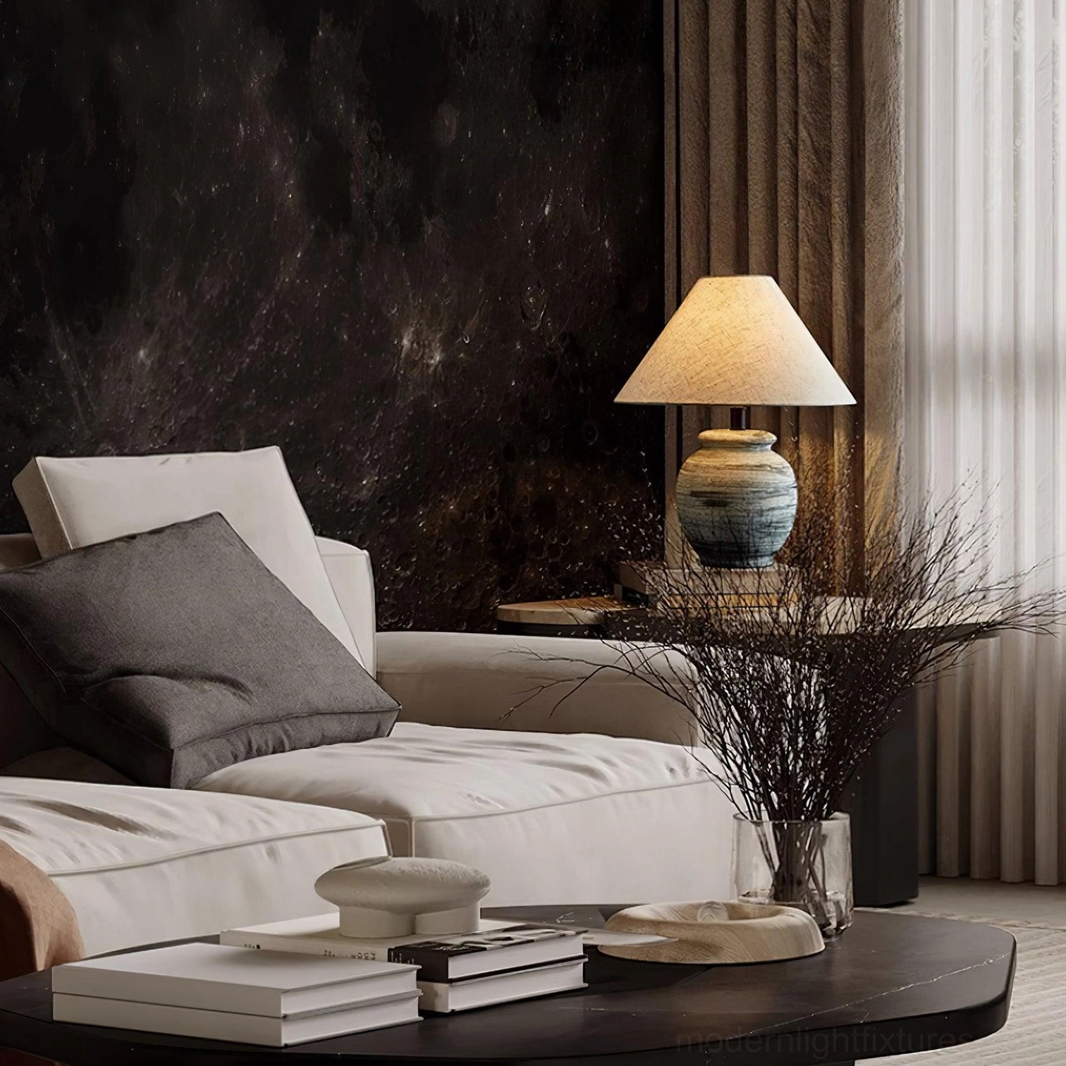 Norma ceramic table lamp providing soft diffused lighting in cozy bedroom corner with neutral textiles