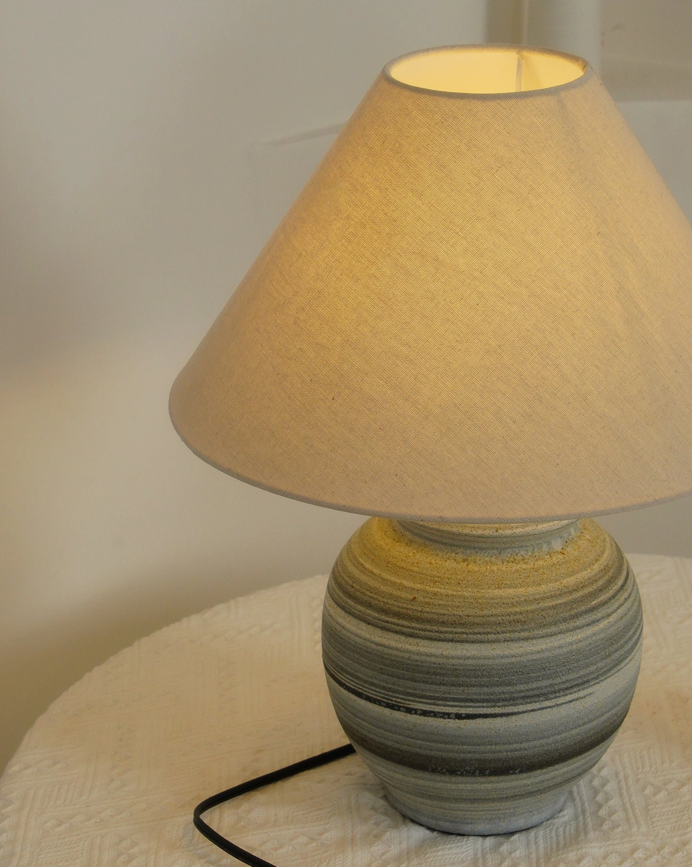 Norma table lamp on antique wooden table with vintage decor and botanical elements in bohemian setting