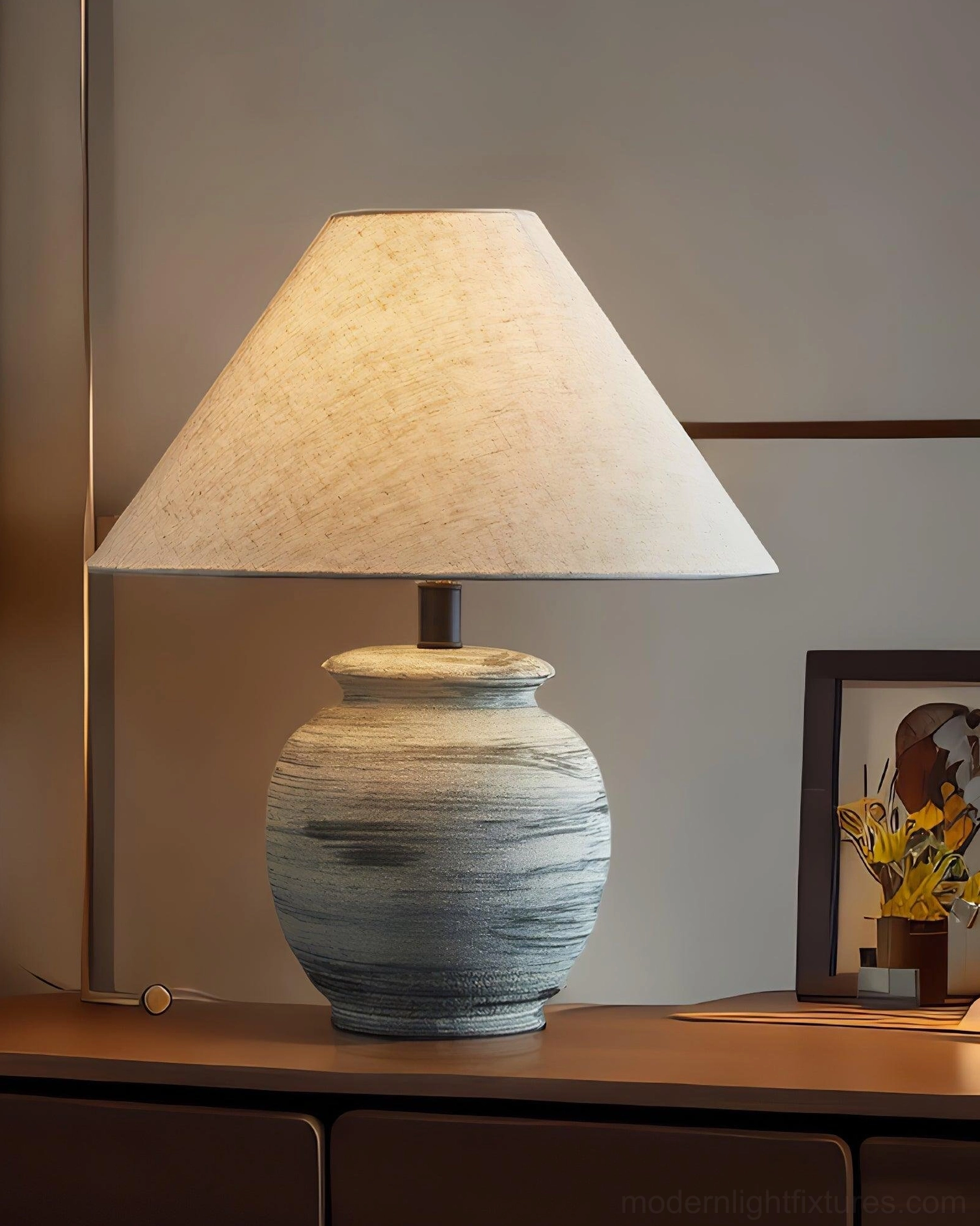 Norma table lamp detailed view of hand-glazed ceramic striped base and natural linen tapered shade