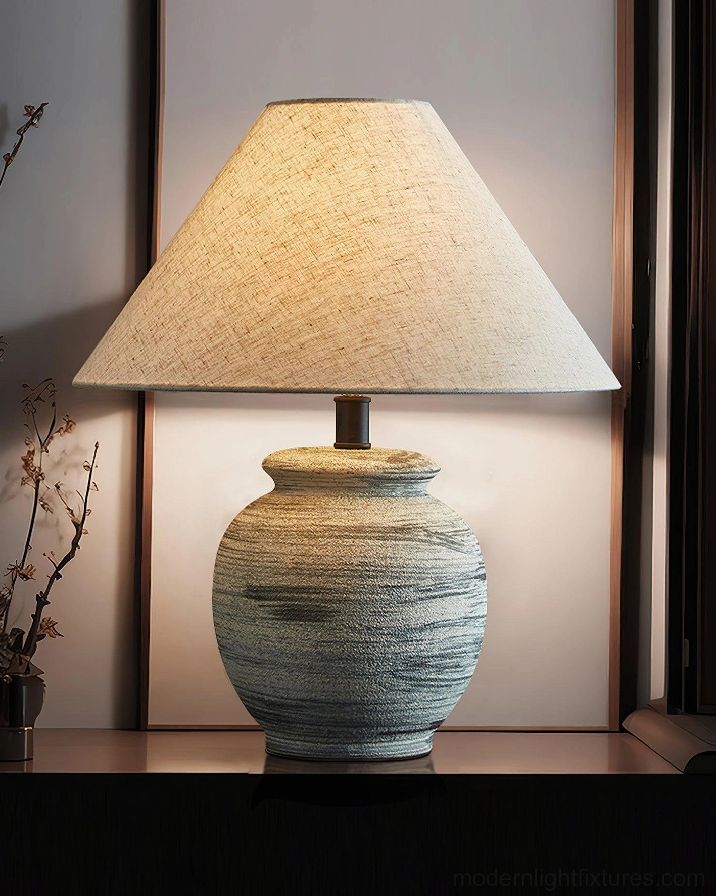 Norma ceramic table lamp close-up front view on console table with backlit wall, detailed base texture