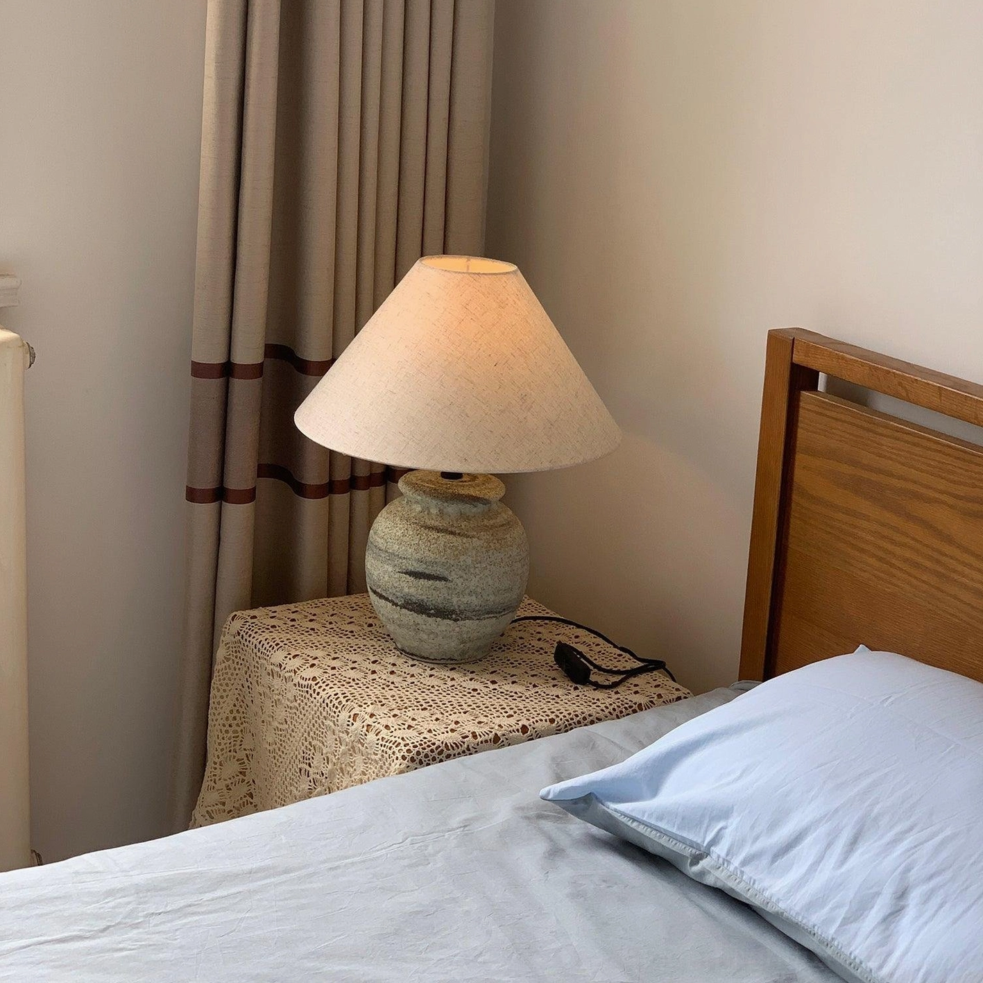 Norma ceramic table lamp as focal accent piece in contemporary home office with natural light