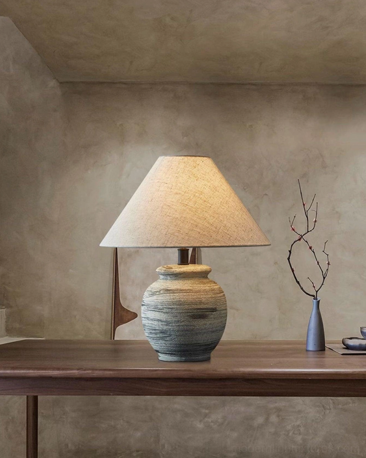 Norma ceramic table lamp on Japanese-style console with dried branch vase, warm neutral backdrop