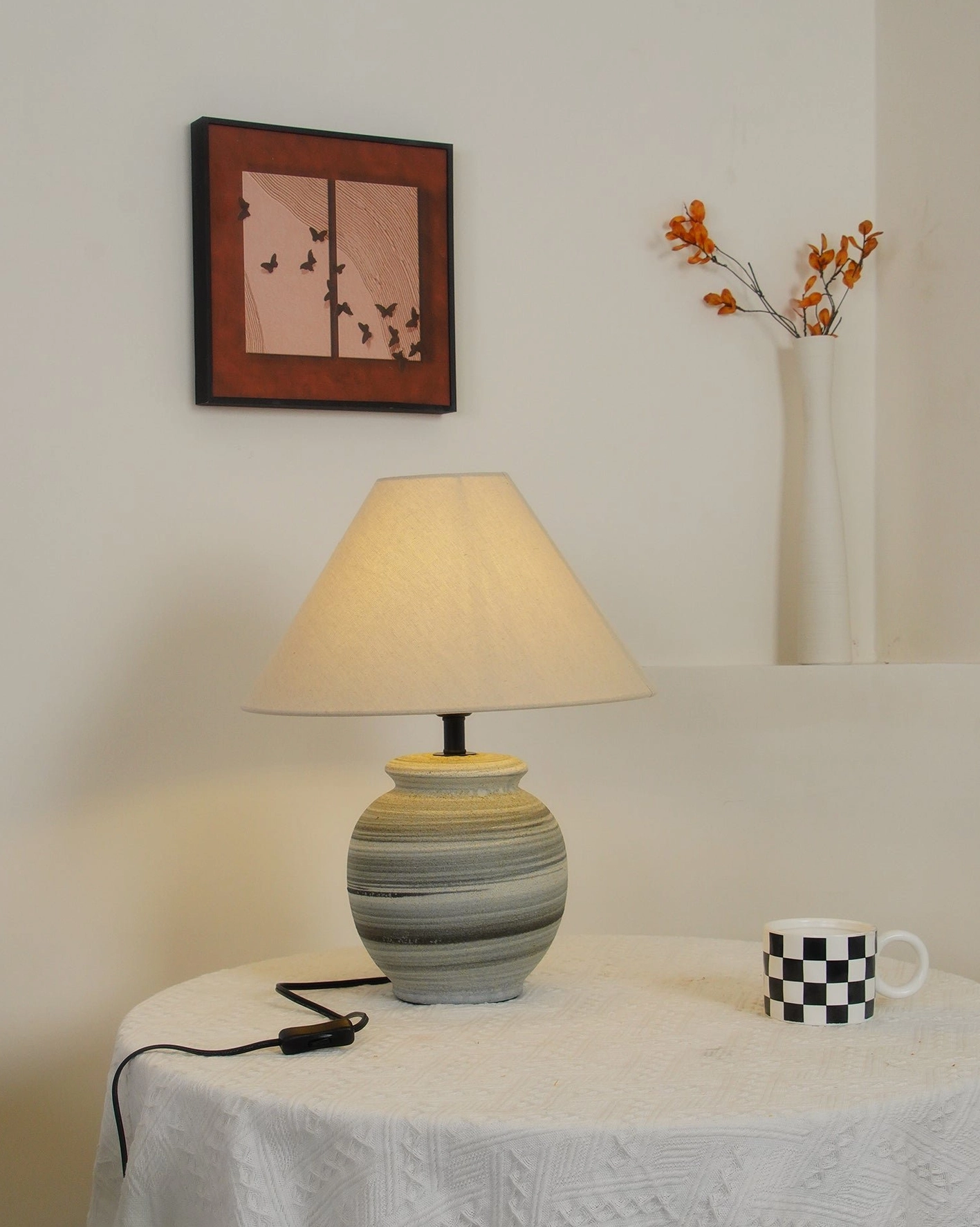 Norma ceramic table lamp detail showing grey and white striped glaze finish and fabric shade construction