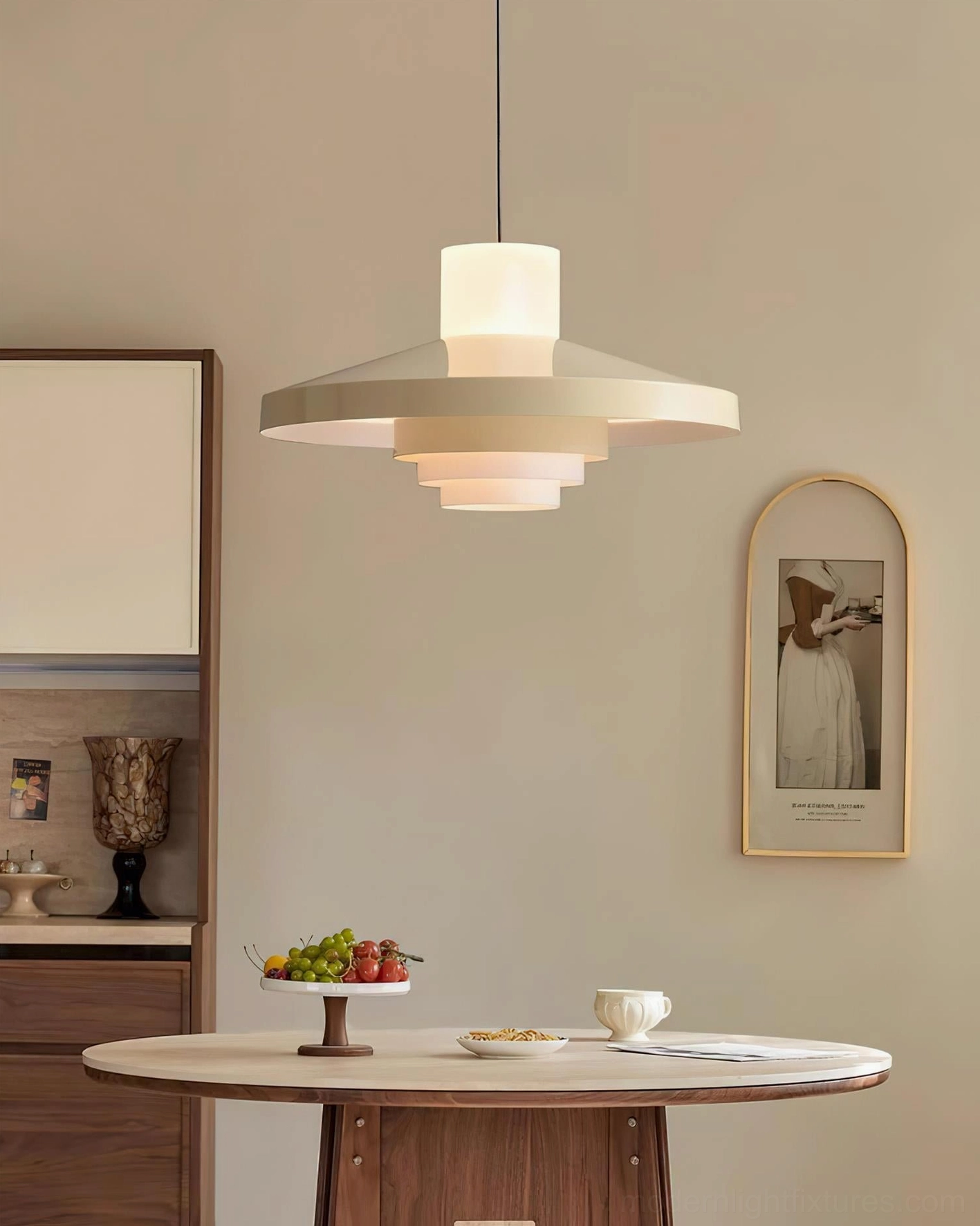 Nova Cap tiered pendant light with beige and off-white shade above kitchen dining nook with warm ambient lighting