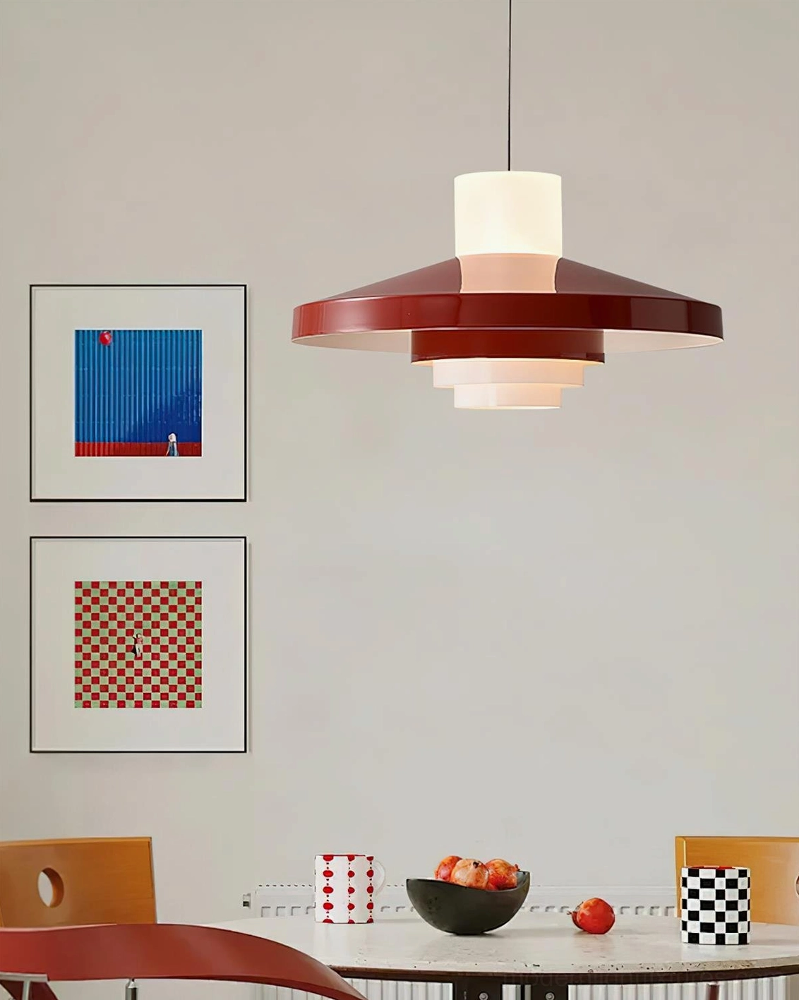 Nova Cap tiered pendant lamp suspended above dining table in warm residential dining room setting