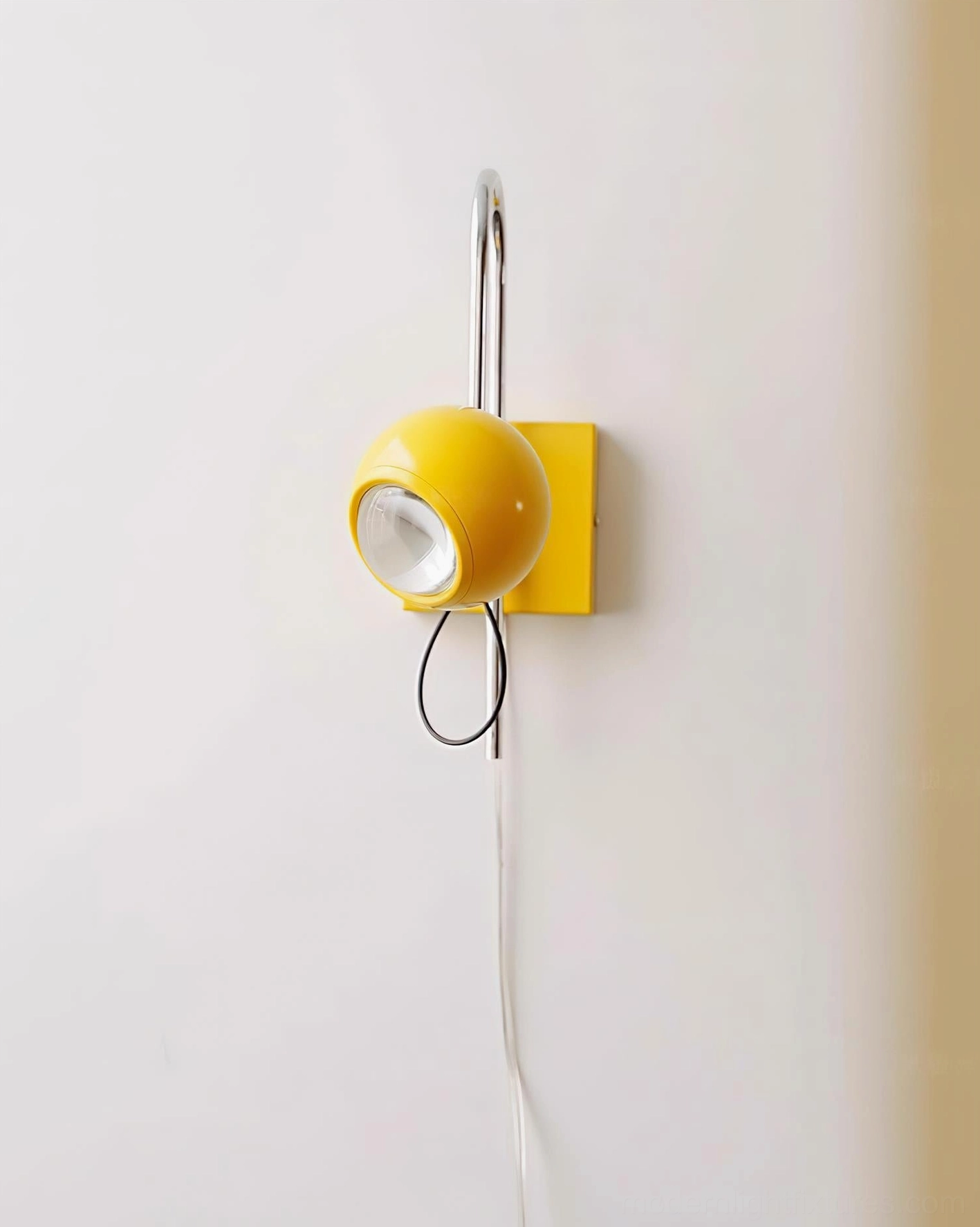 Nova Dot wall sconce showcasing design versatility with adjustable positioning capability and geometric dome shade