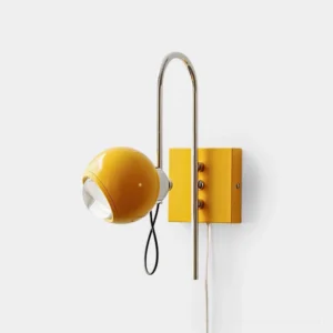 Nova Dot yellow mid-century modern wall sconce with adjustable chrome stem on white indoor wall, left front side view