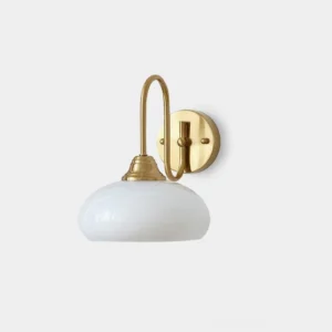 Nova minimalist glass wall sconce with textured shade front view, brass gold metal base with white milk glass dome