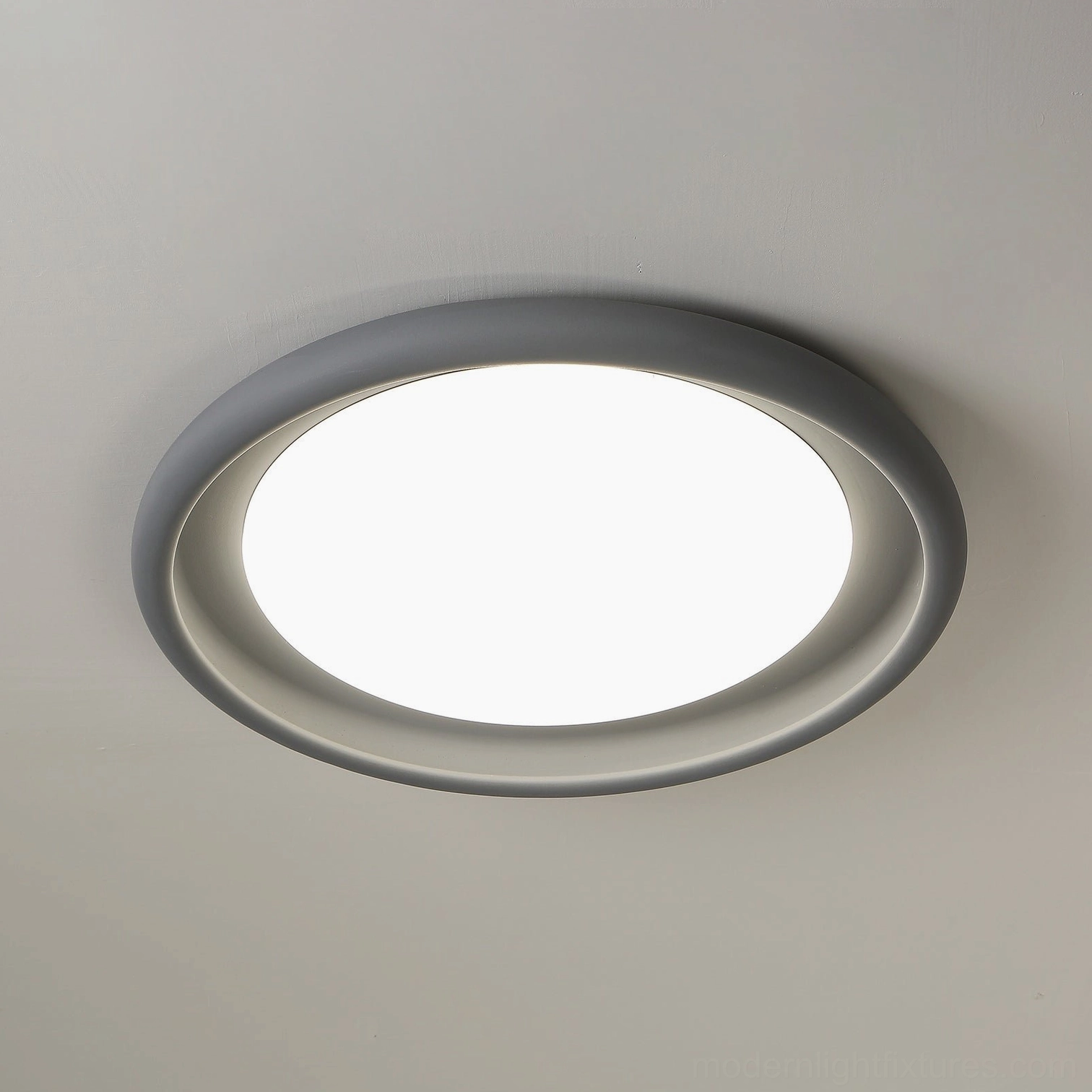 Dual-tone gray double-layer ceiling light close-up, low-angle overhead view of matte finish