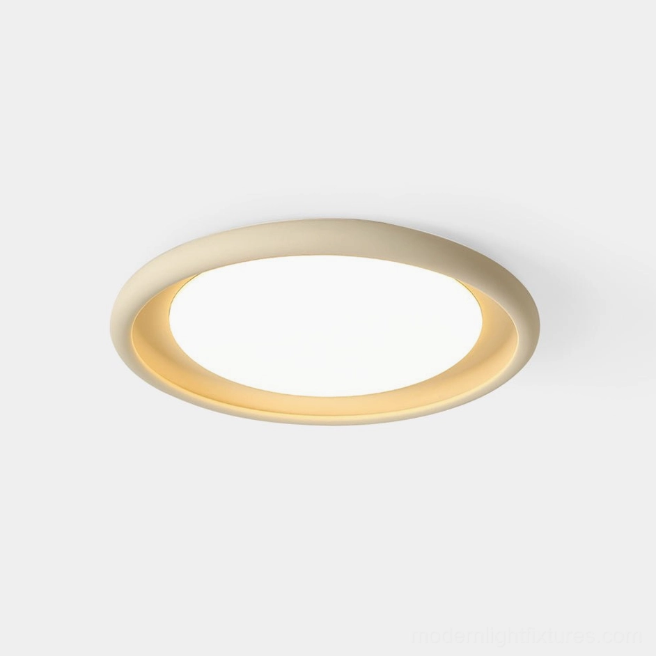 Nuria modern minimalist ceiling light with warm LED glow in studio lighting, front flat lay view