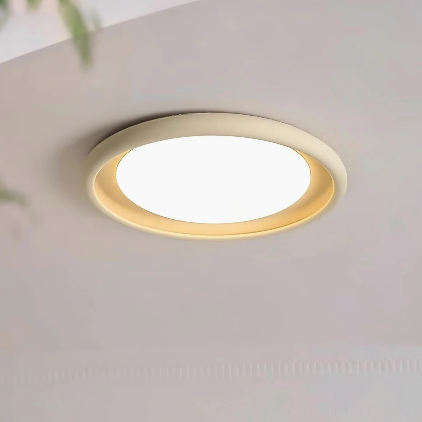 Modern round flush-mount ceiling light in warm white 3000K color temperature, overhead installation view