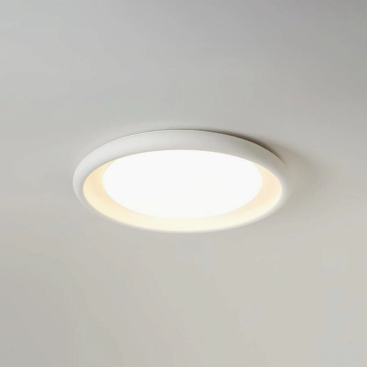 Nuria white flush-mount ceiling light with warm LED illumination, installed overhead in contemporary space