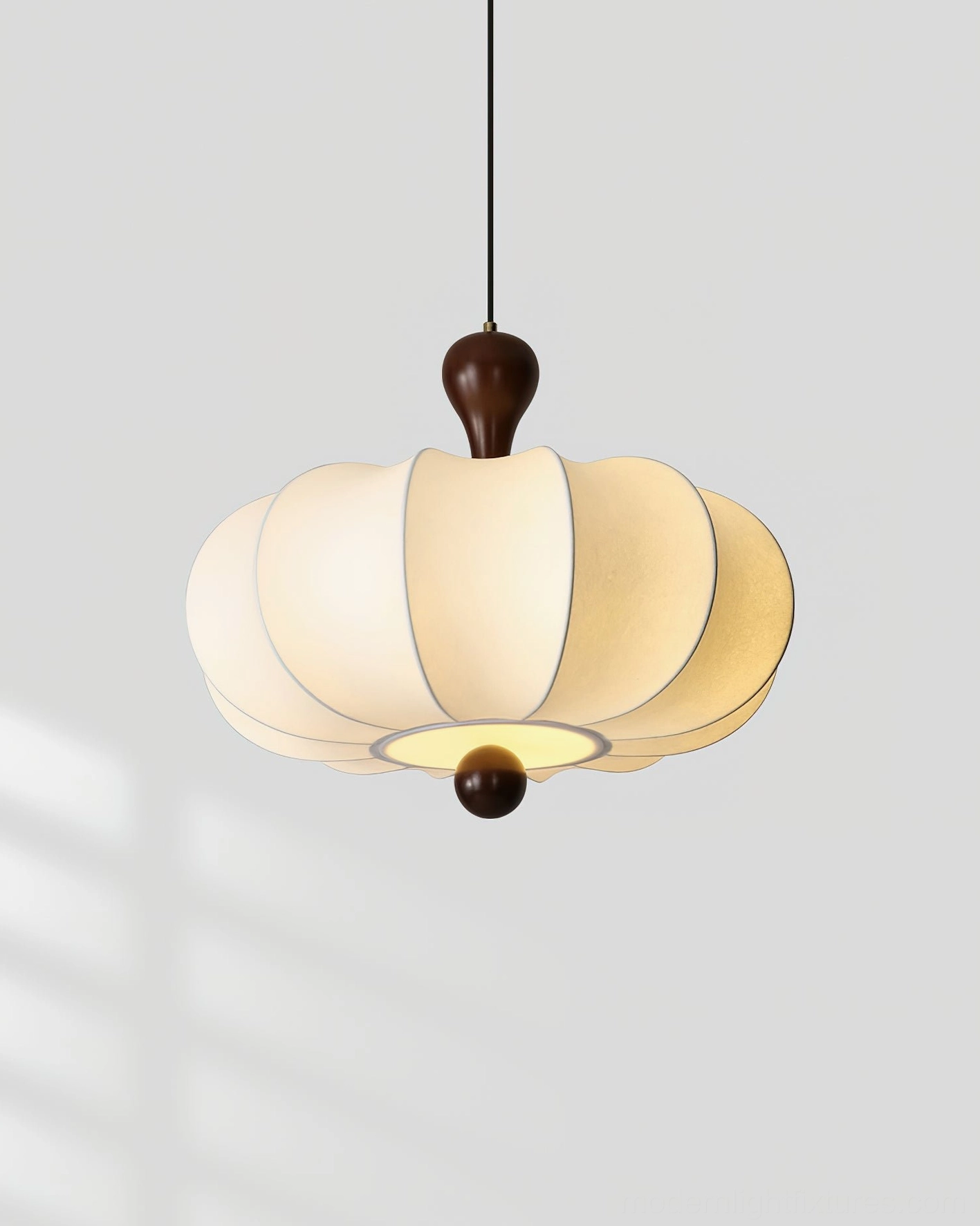 Nutria beige pendant light illuminated in contemporary home interior