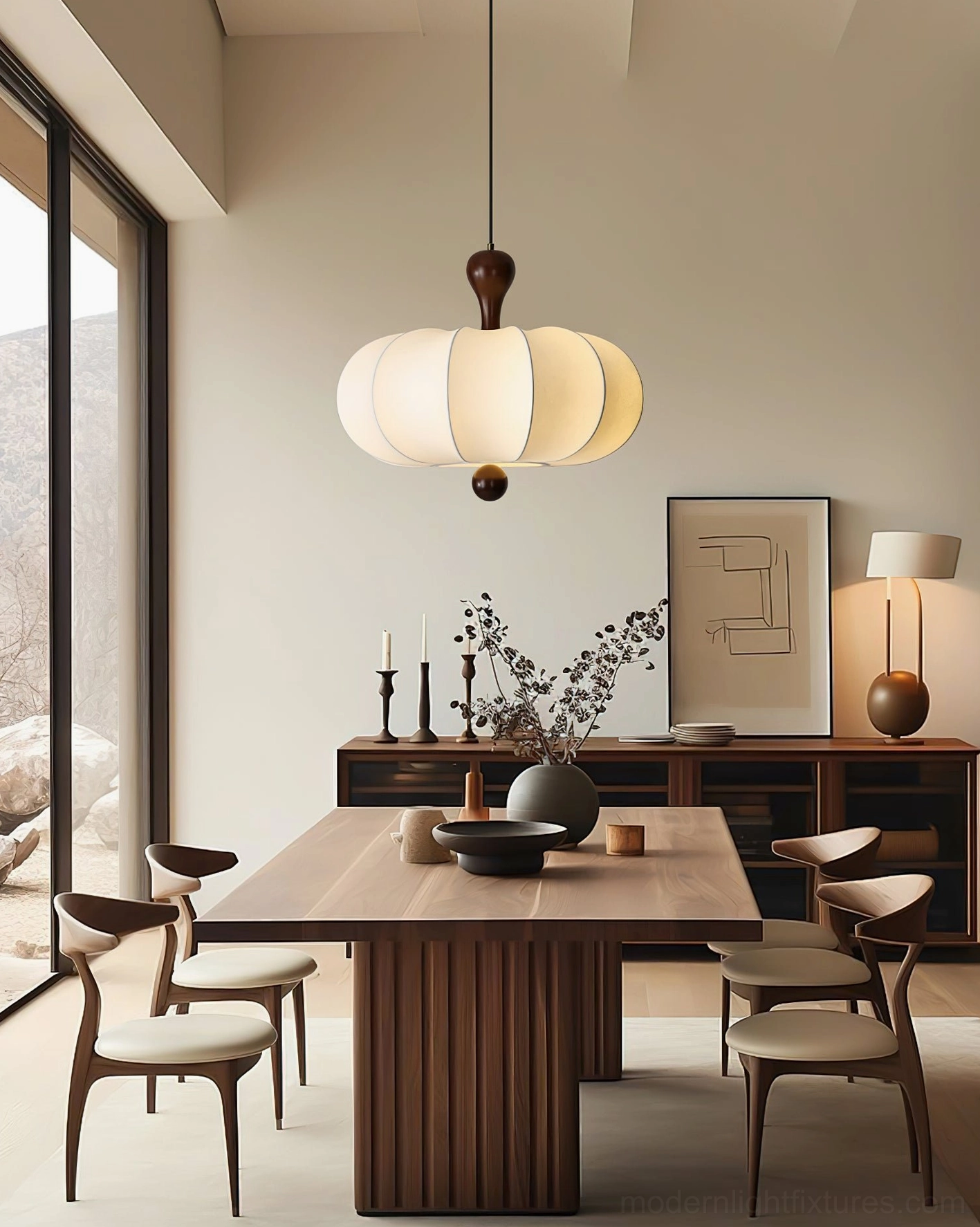 Nutria modern pendant light hanging above wooden dining table in japandi interior