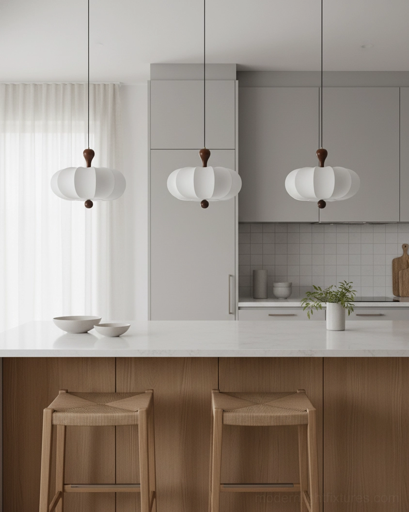 Nutria matching pendant lights cluster over kitchen island in japandi kitchen design