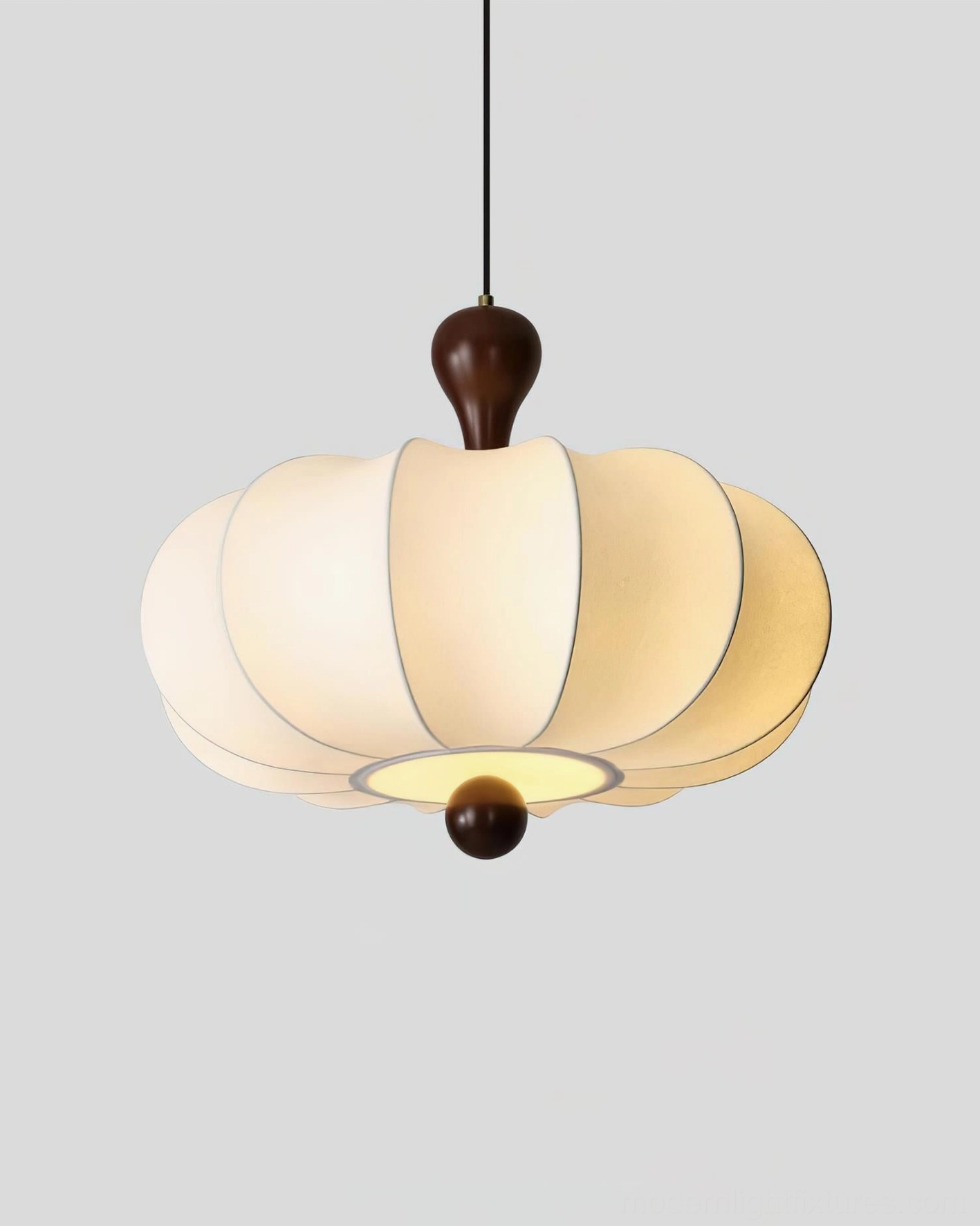 Nutria pendant light multiple installation above dining table arrangement