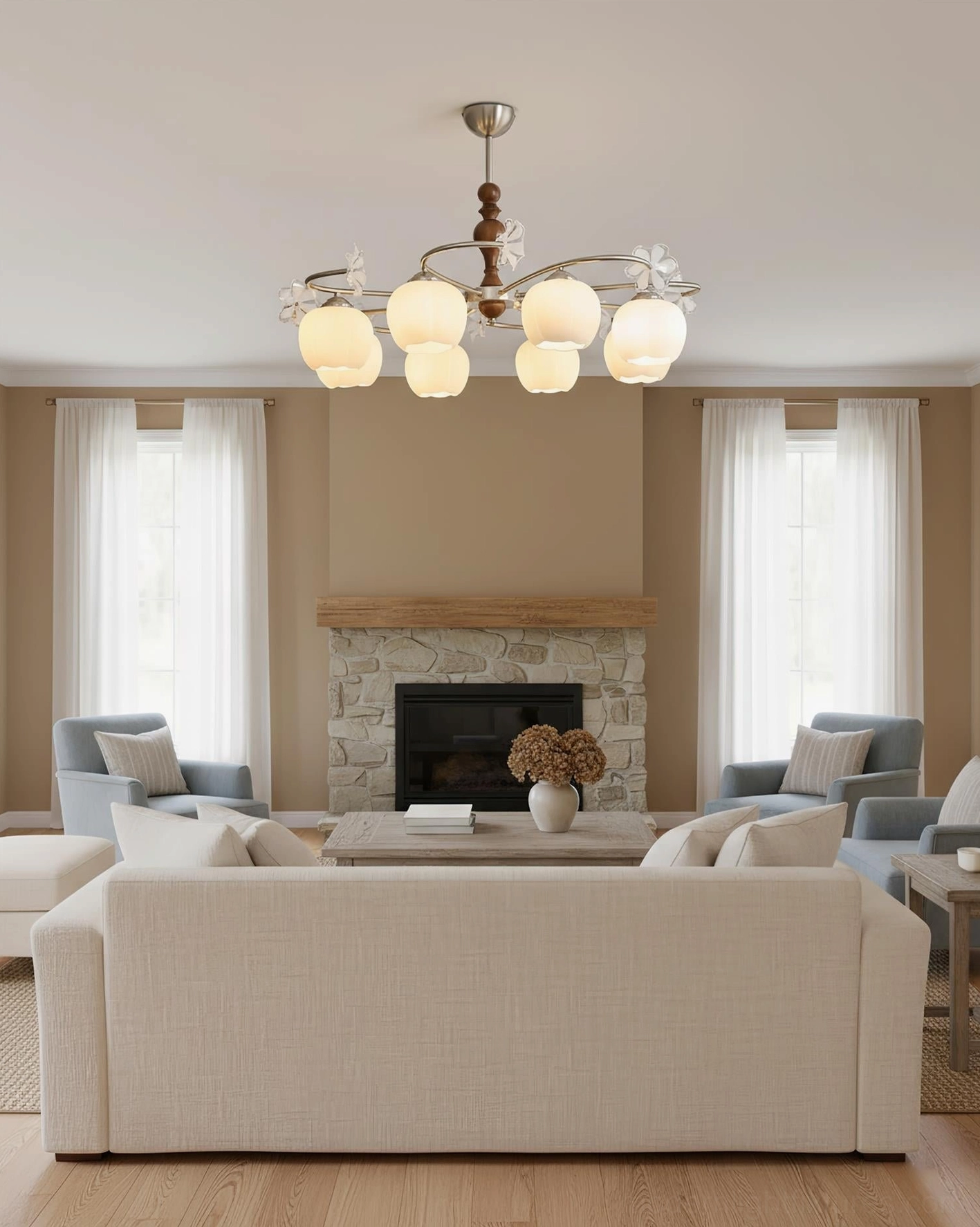 Large 8-head Nuvafleur botanical glass chandelier in spacious living room with stone fireplace and warm lighting