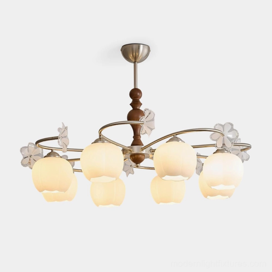 Nuvafleur botanical glass chandelier with frosted tulip-shaped shades, brushed brass frame, and decorative wood details, front studio view