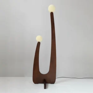 Handcrafted solid oak floor lamp with two frosted glass globe shades, three-quarter view with power cord and foot switch visible